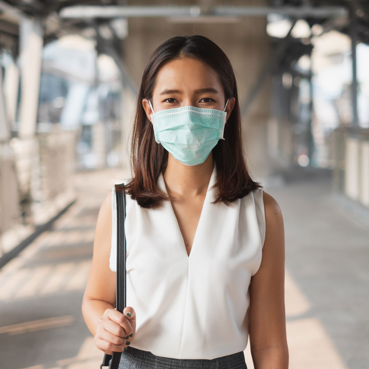 Business woman in a medical mask